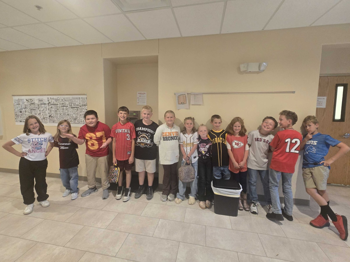 giving-2026 image UBCA students lined up in sports jerseys during Spirit Week